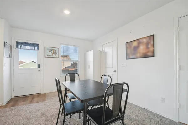 a view of a dining room with furniture