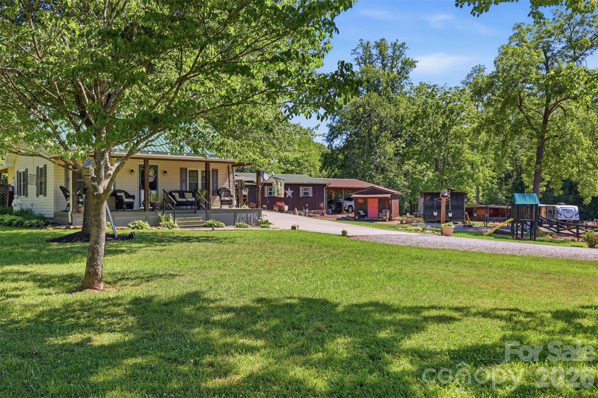 176-174 Oak Hollow Road Union Grove, NC 28689 - Photo 3 of 48 a view of a house with a yard patio and swimming pool