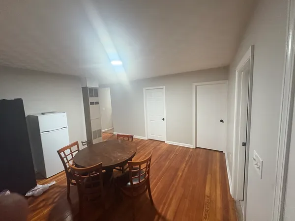 a bedroom with a bed and a table in it