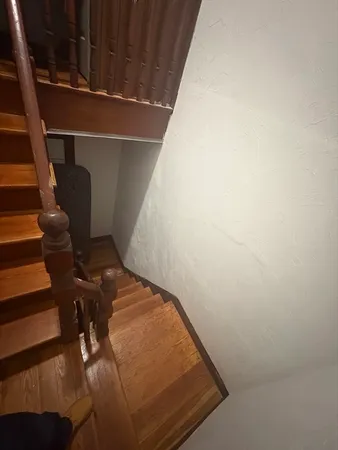 a view of balcony with wooden floor