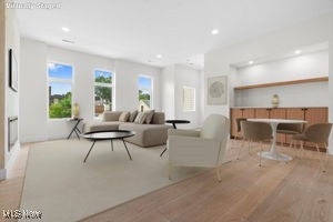 Living room featuring wood finished floors and recessed lighting