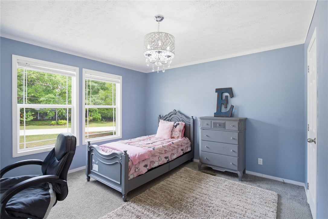 119 Fruit Mountain Road Easley, SC 29640 - Photo 17 of 31 This bright room features abundant natural light and a charming overhead fixture.