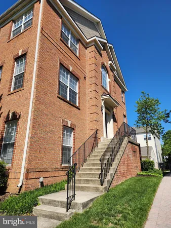 a view of a building with a yard