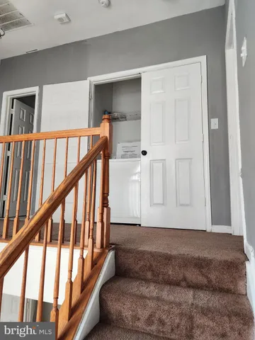 a view of an entryway with wooden floor