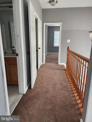 a view of a hallway view with staircase