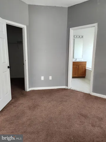 a view of an empty room and a window