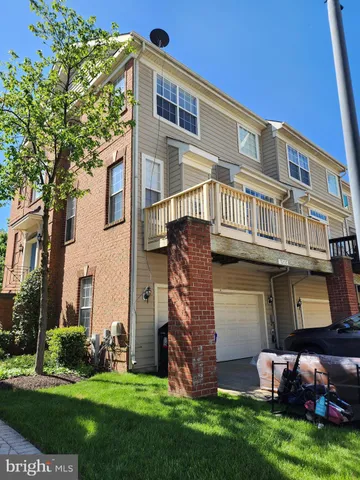 a brick building with a yard