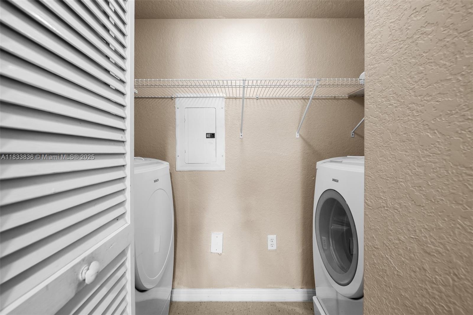 6722 West Sample Road, Unit 6722 Coral Springs, FL 33067 - Photo 11 of 23 a close view of a utility room with dryer and washer