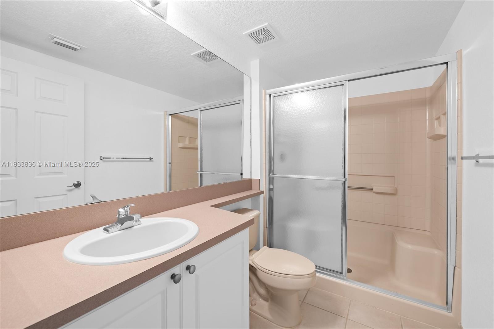 6722 West Sample Road, Unit 6722 Coral Springs, FL 33067 - Photo 20 of 23 a bathroom with a sink toilet and shower