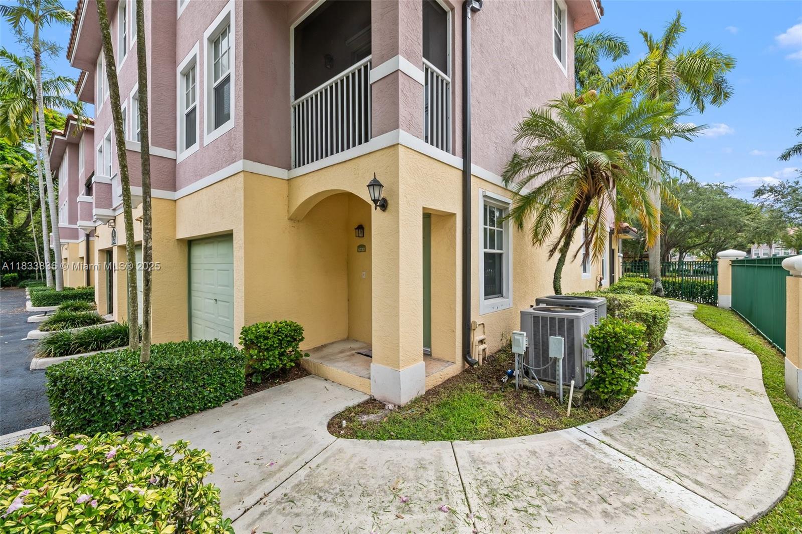 6722 West Sample Road, Unit 6722 Coral Springs, FL 33067 - Photo 2 of 23 a view of outdoor space yard and porch