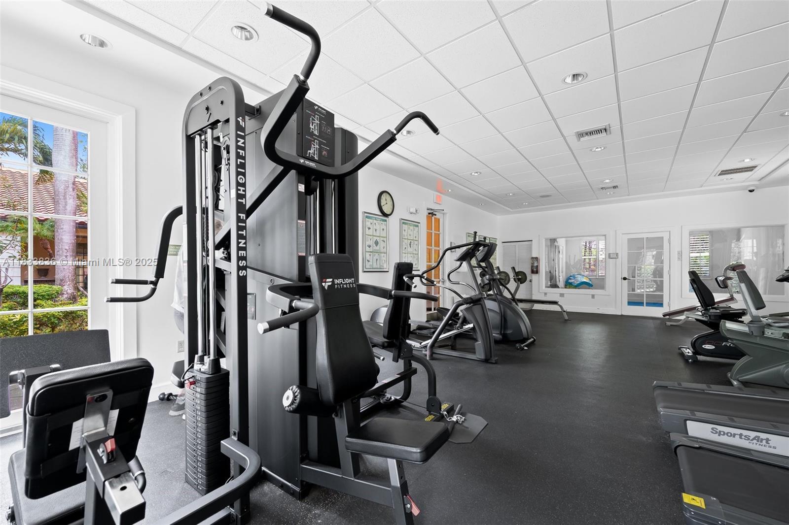 6722 West Sample Road, Unit 6722 Coral Springs, FL 33067 - Photo 22 of 23 a view of a room with gym equipment
