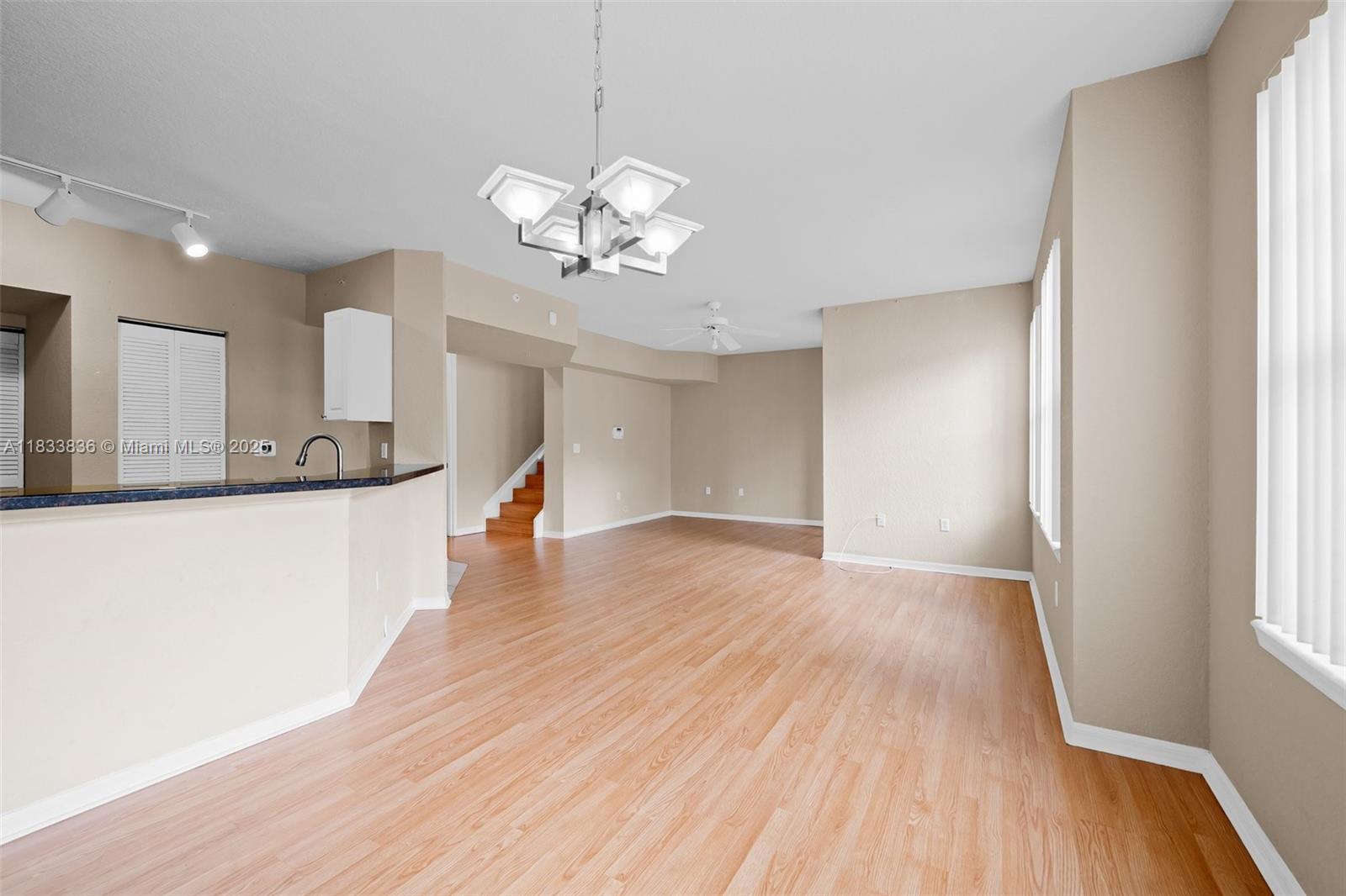 6722 West Sample Road, Unit 6722 Coral Springs, FL 33067 - Photo 5 of 23 a view of a kitchen with a dishwasher and wooden floor