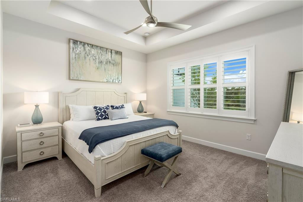 6847 Saona Court Naples, FL 34113 - Photo 12 of 47 a bedroom with bed and a window