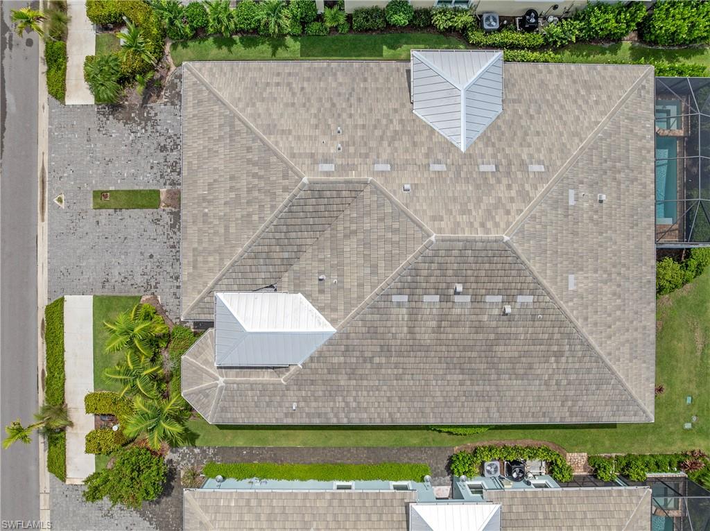 6847 Saona Court Naples, FL 34113 - Photo 23 of 47 an aerial view of a house with a yard