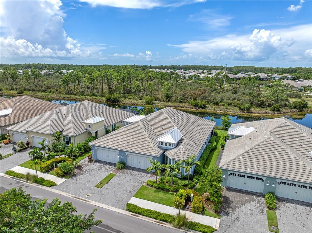 6847 Saona Court Naples, FL 34113 - Photo 25 of 47 an aerial view of a house with a garden