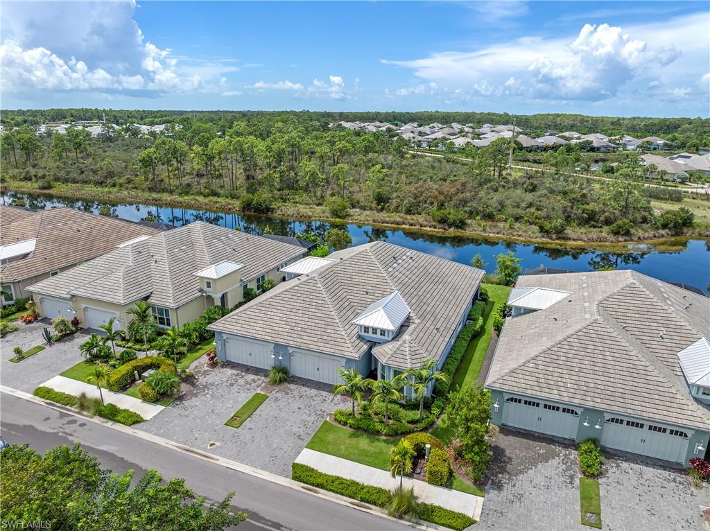 6847 Saona Court Naples, FL 34113 - Photo 26 of 47 an aerial view of a house with a ocean view
