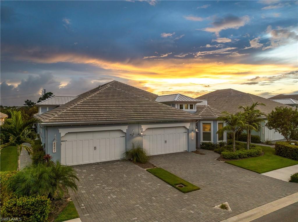 6847 Saona Court Naples, FL 34113 - Photo 28 of 47 a view of house with outdoor space