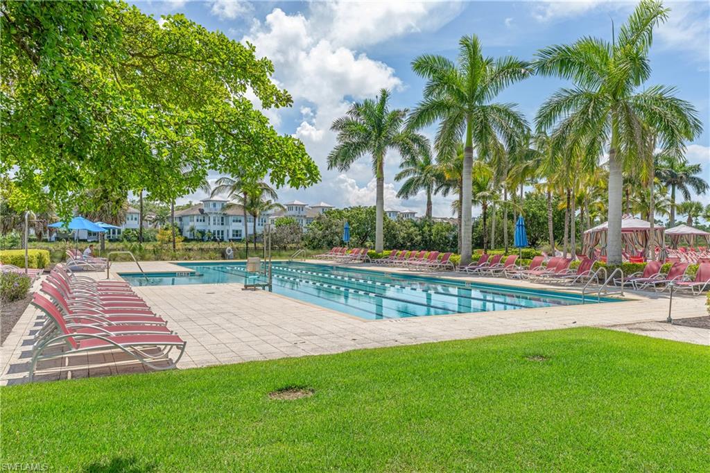 6847 Saona Court Naples, FL 34113 - Photo 36 of 47 a view of a yard and swimming pool