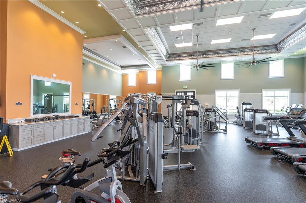 6847 Saona Court Naples, FL 34113 - Photo 40 of 47 a view of a room with gym equipment