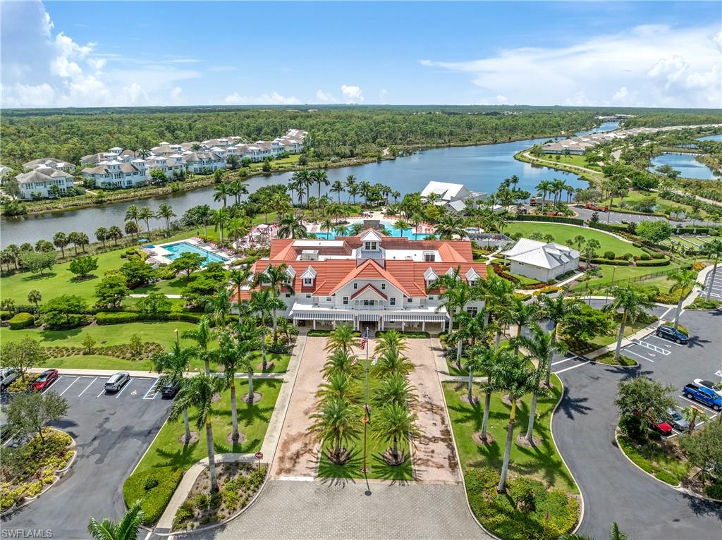 6847 Saona Court Naples, FL 34113 - Photo 46 of 47 an aerial view of residential houses with outdoor space and river