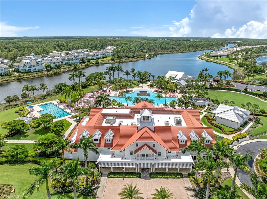 6847 Saona Court Naples, FL 34113 - Photo 47 of 47 an aerial view of residential houses with outdoor space and river