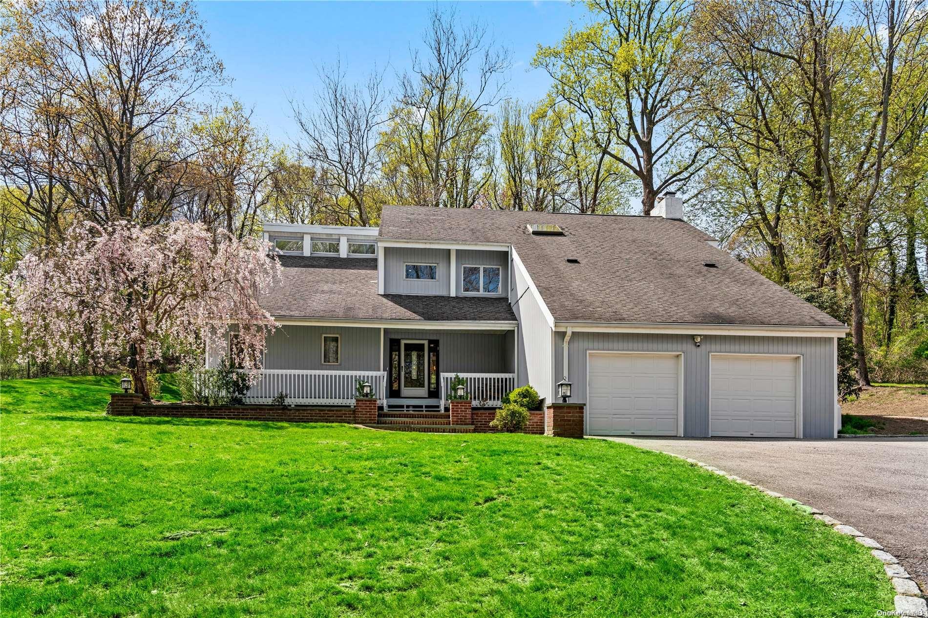 272 Southdown Road Lloyd Harbor, NY 11743 - Photo 1 of 1 a front view of house with yard and green space