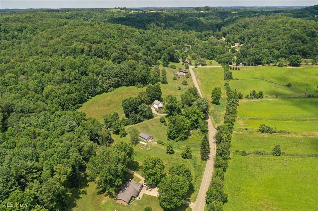 1728 Tall Timber Road Northeast New Philadelphia, OH 44663 - Photo 11 of 39 View of rural area with a heavily wooded area