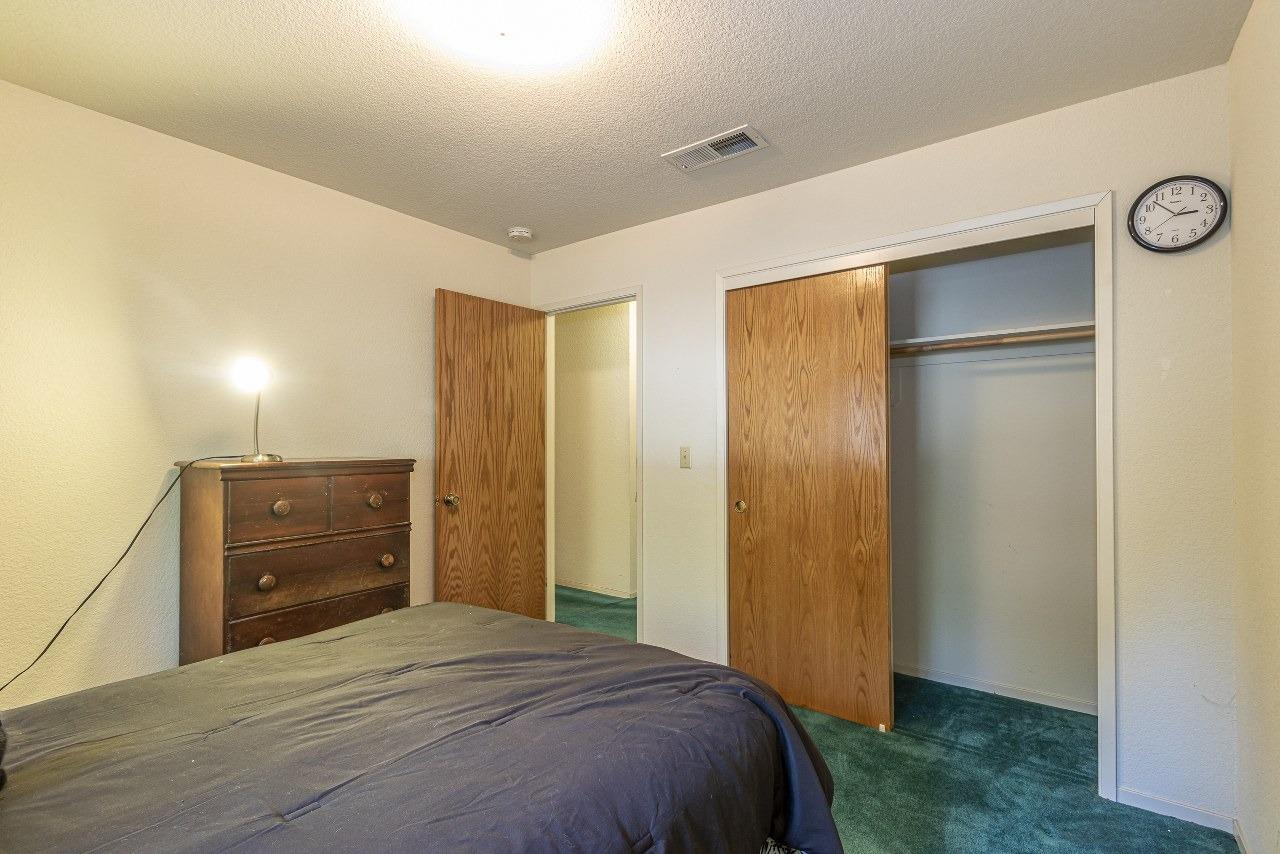 59634 Cascadel Drive North Fork, CA 93643 - Photo 19 of 52 a bedroom with a bed and a dresser