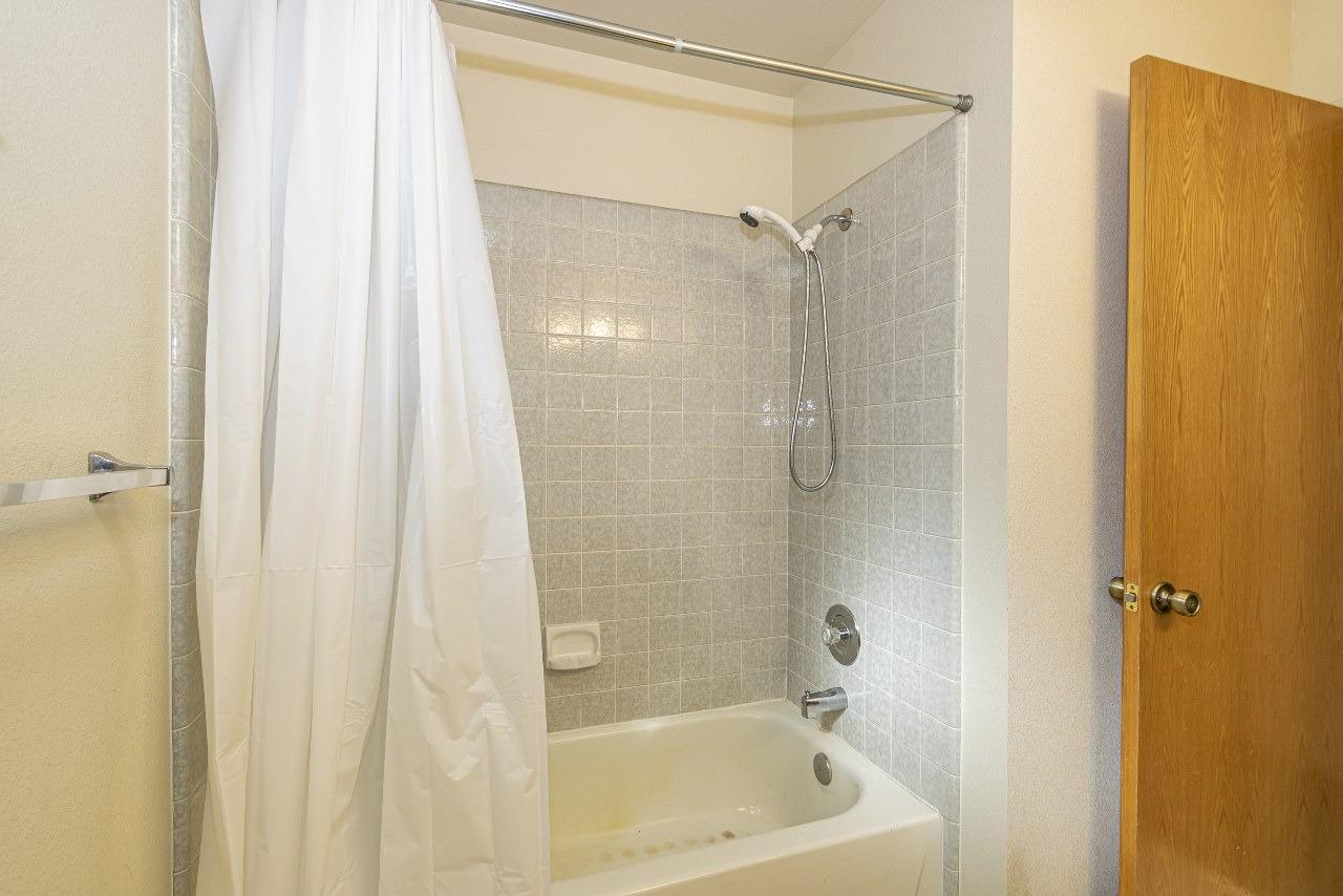 59634 Cascadel Drive North Fork, CA 93643 - Photo 22 of 52 a bathroom with a shower and a bath tub