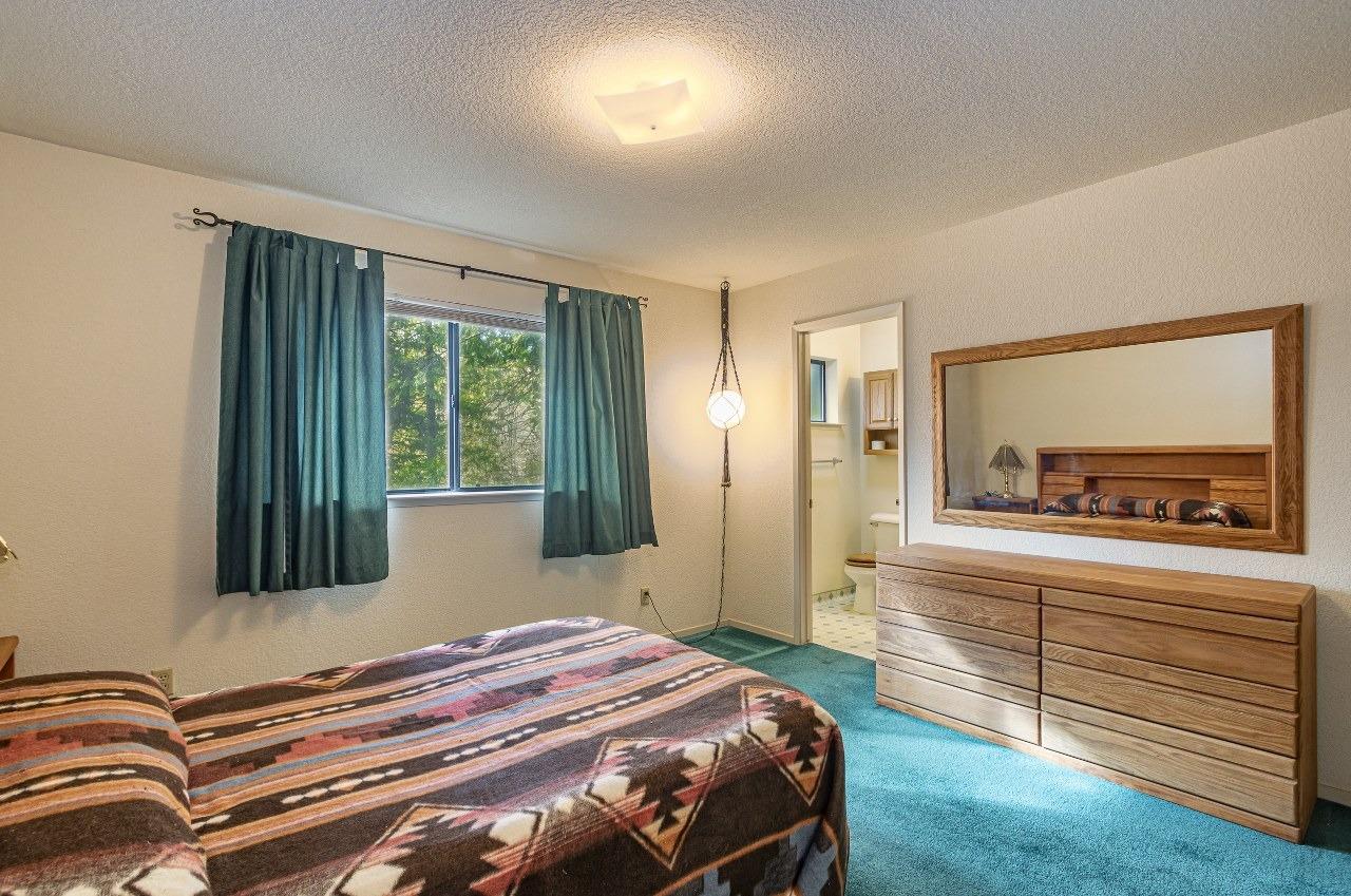 59634 Cascadel Drive North Fork, CA 93643 - Photo 26 of 52 a bedroom with a bed and a dresser