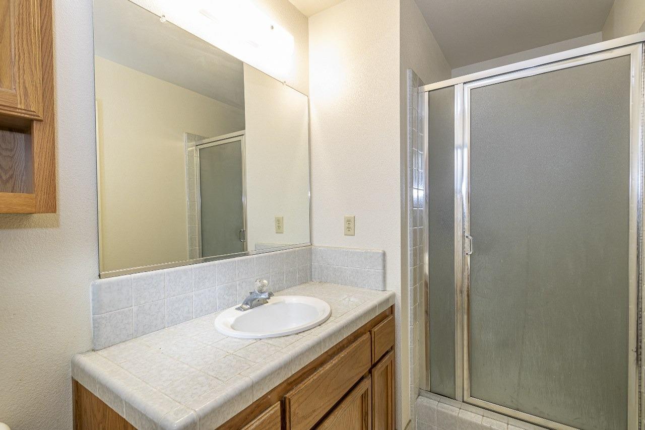 59634 Cascadel Drive North Fork, CA 93643 - Photo 28 of 52 a bathroom with a sink and a mirror