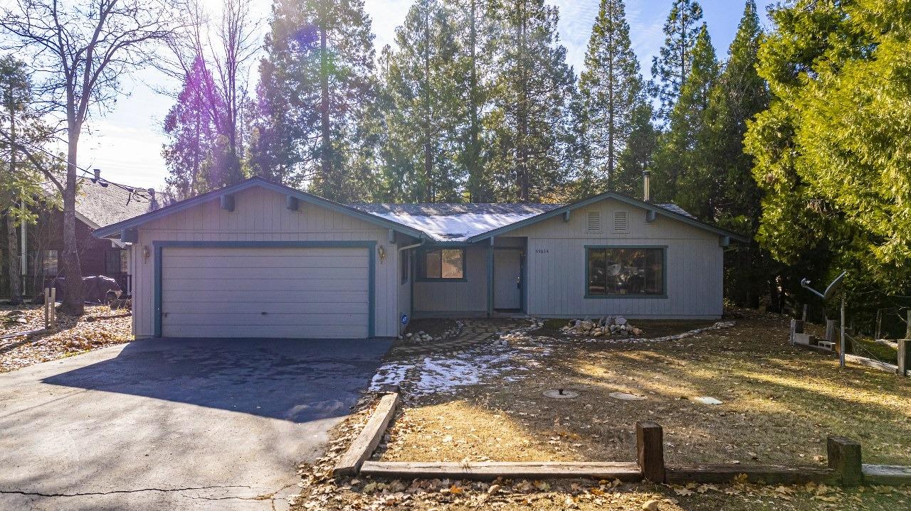 59634 Cascadel Drive North Fork, CA 93643 - Photo 48 of 52 a view of a yard with large tree and wooden fence