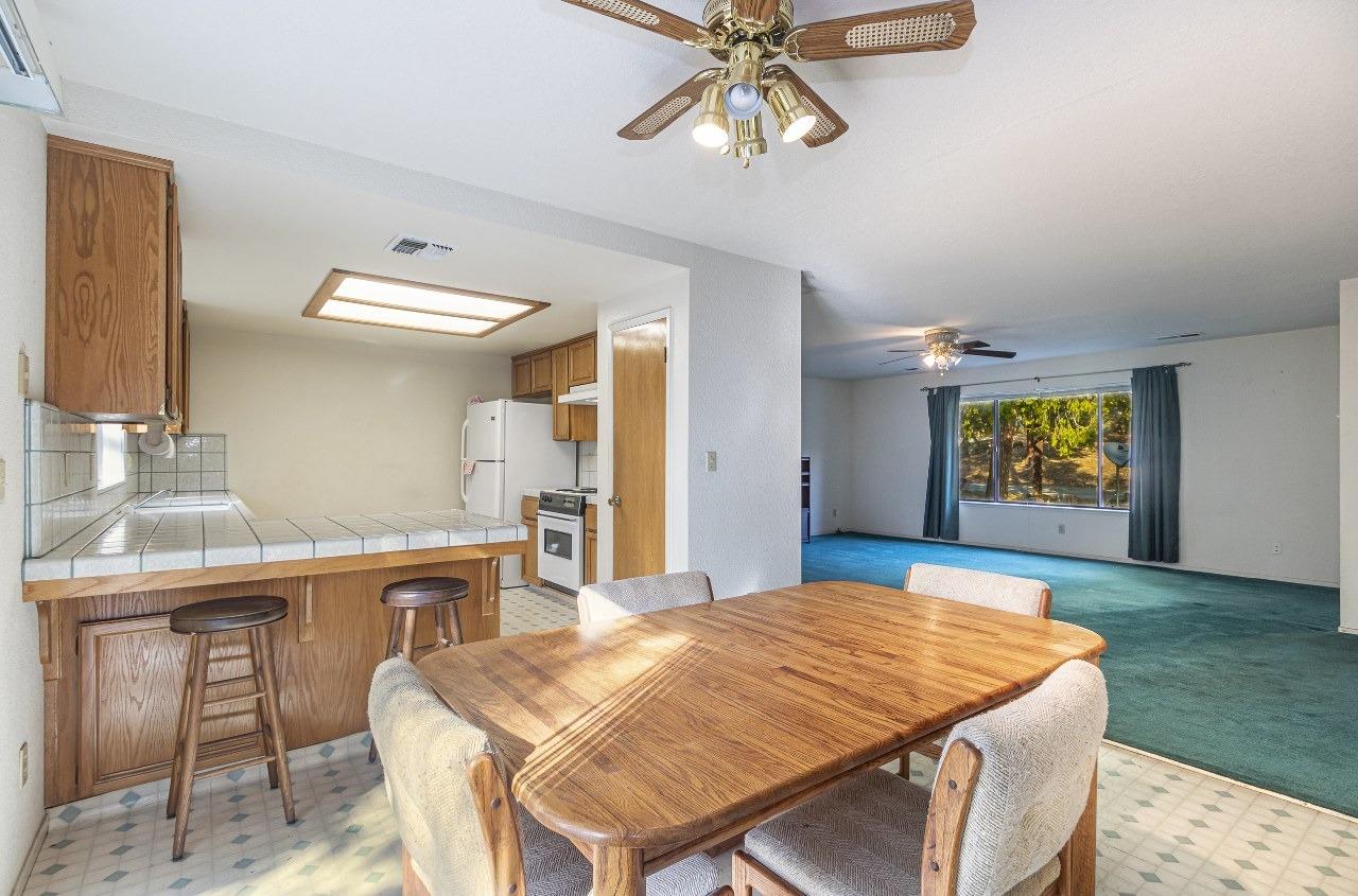 59634 Cascadel Drive North Fork, CA 93643 - Photo 8 of 52 a bedroom with a bed and a table