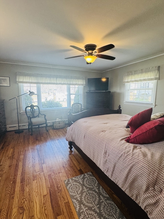 649 Stafford Road Fall River, MA 02721 - Photo 12 of 17 a bedroom with a bed and wooden floor