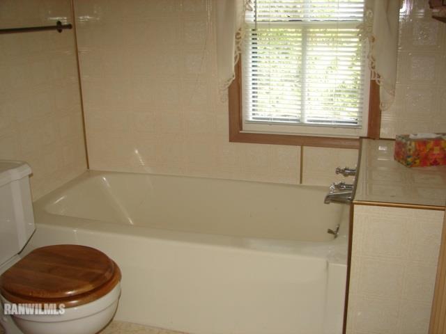 671 North Kent Road Kent, IL 61044 - Photo 19 of 22 a bathroom with a shower and a toilet