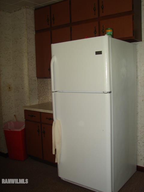 671 North Kent Road Kent, IL 61044 - Photo 7 of 22 a white refrigerator freezer sitting in a kitchen