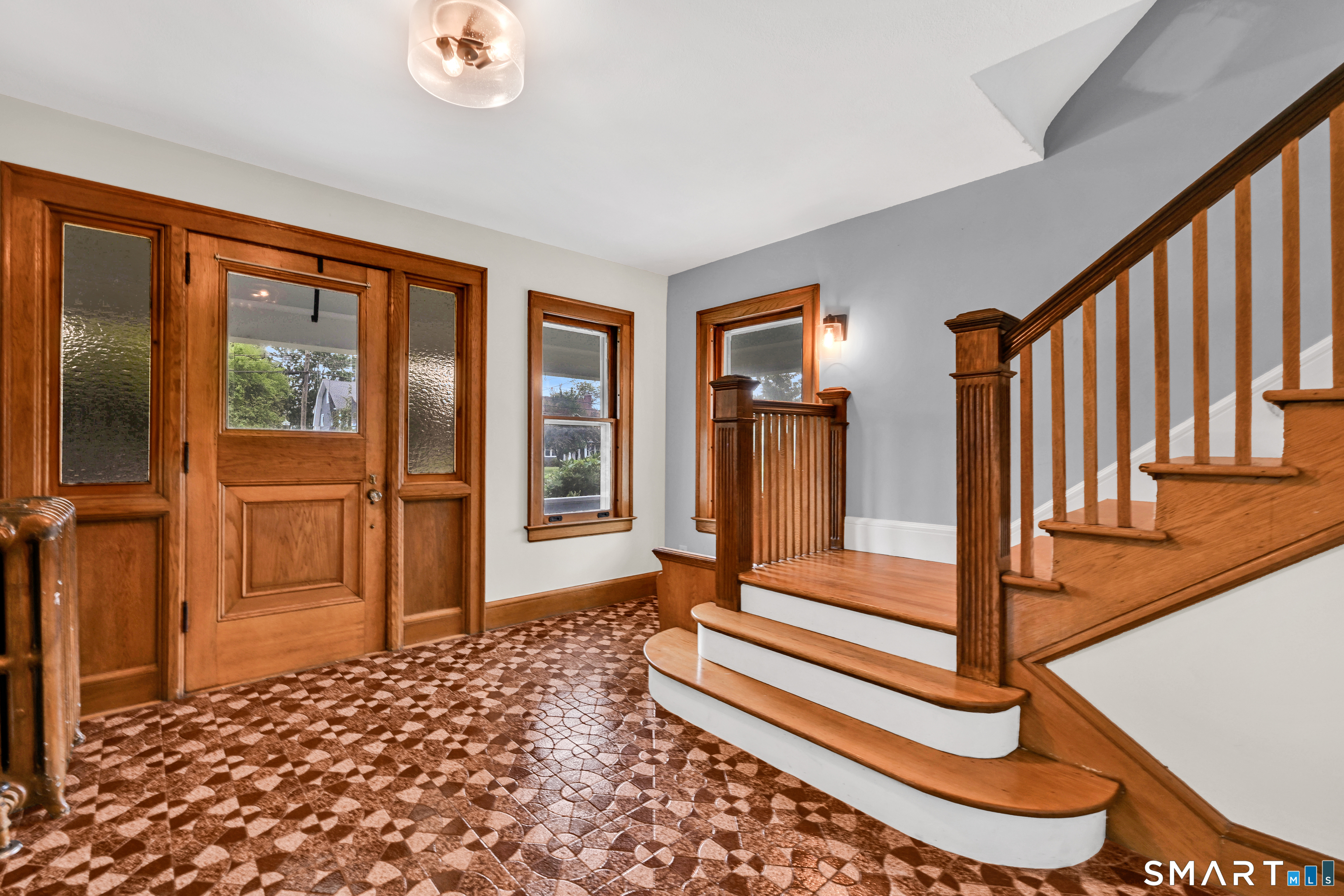 295 Wolcott Hill Road Wethersfield, CT 06109 - Photo 2 of 40 Gorgeous entryway with period wood fireplace, gorgeous original door and all that charm