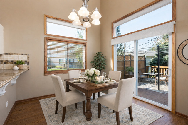 323 Mallard Lane Sugar Grove, IL 60554 - Photo 12 of 32 a dining room with furniture a chandelier and wooden floor