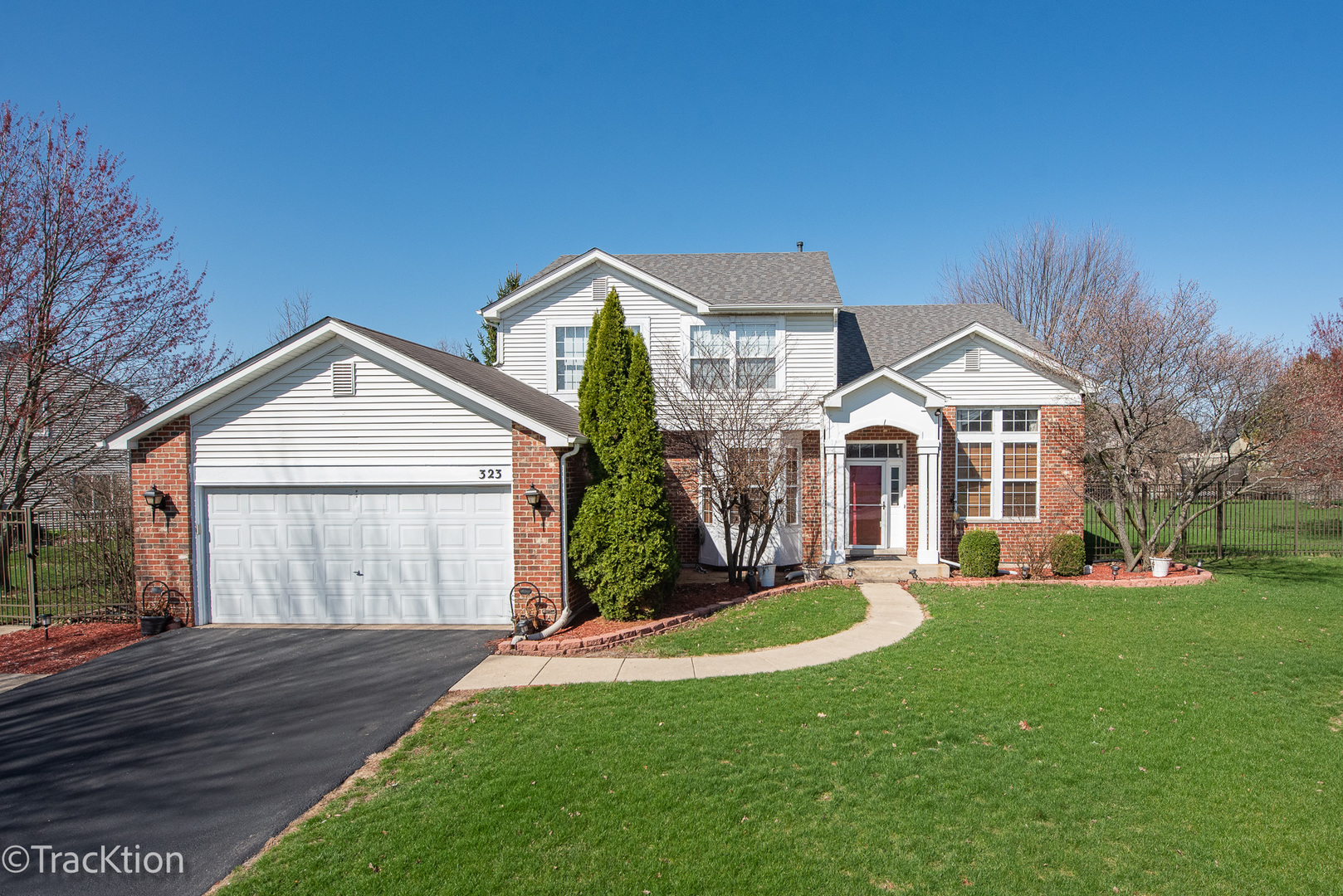 323 Mallard Lane Sugar Grove, IL 60554 - Photo 2 of 32 a front view of a house with a yard and garage