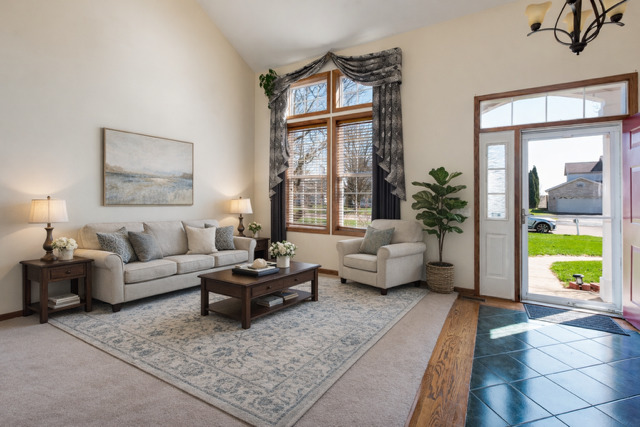 323 Mallard Lane Sugar Grove, IL 60554 - Photo 3 of 32 a living room with furniture and a large window with garden view