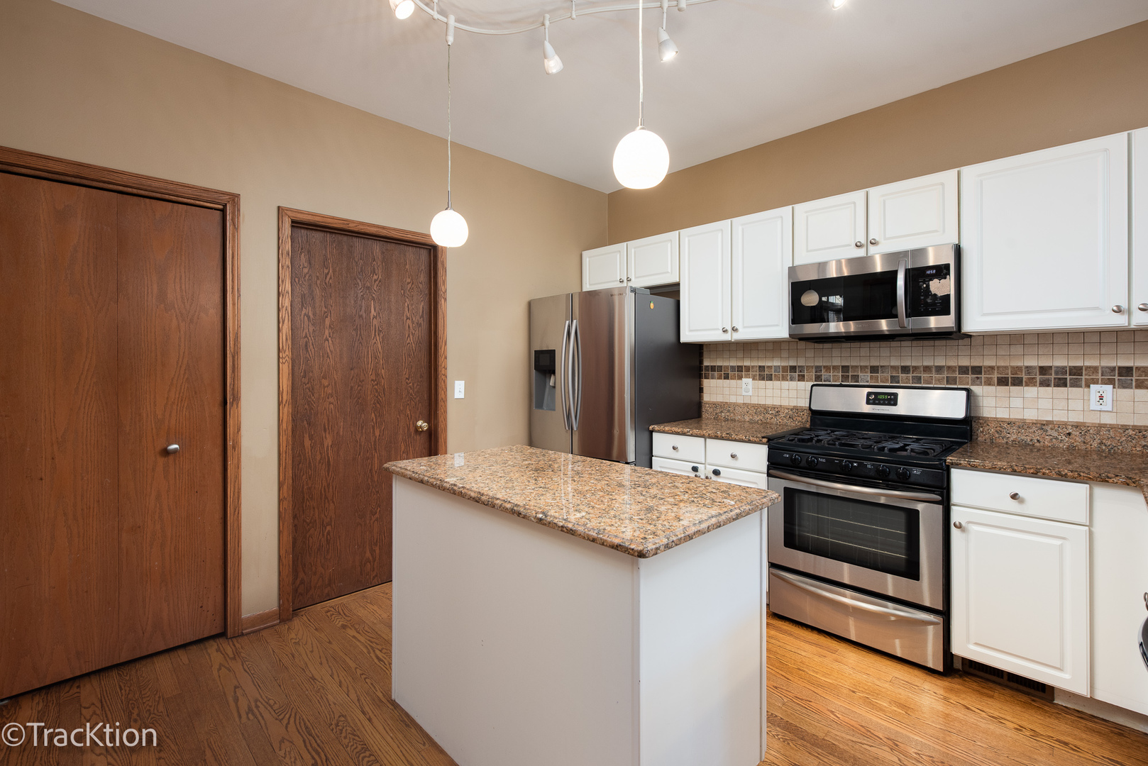 323 Mallard Lane Sugar Grove, IL 60554 - Photo 10 of 32 a kitchen with stainless steel appliances granite countertop a stove a refrigerator and a microwave