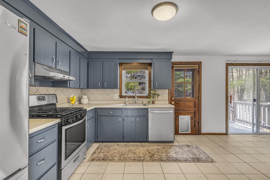 50 Harlow Road Rockland, MA 02370 - Photo 13 of 38 a kitchen with stainless steel appliances granite countertop a stove a sink and a refrigerator