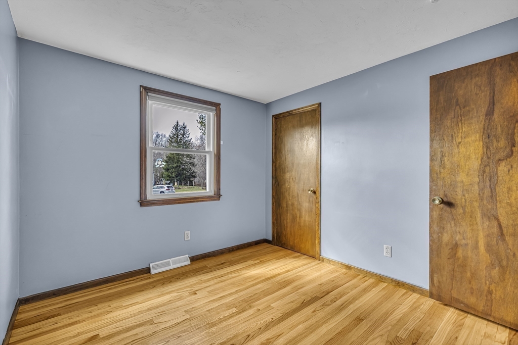50 Harlow Road Rockland, MA 02370 - Photo 15 of 38 a view of an empty room with wooden floor and a window