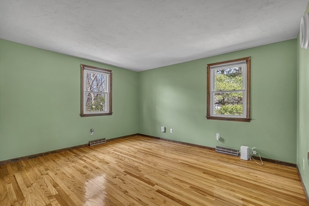 50 Harlow Road Rockland, MA 02370 - Photo 16 of 38 a view of empty room with window and wooden floor