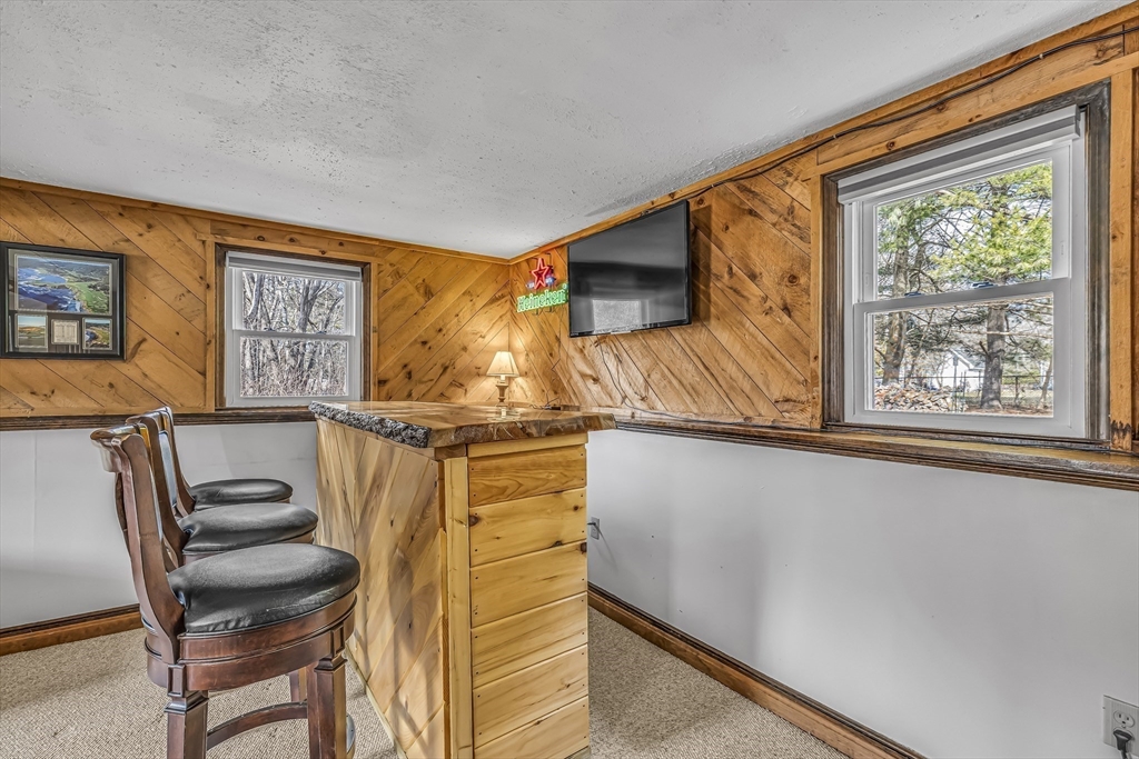 50 Harlow Road Rockland, MA 02370 - Photo 22 of 38 a living room with furniture and a window