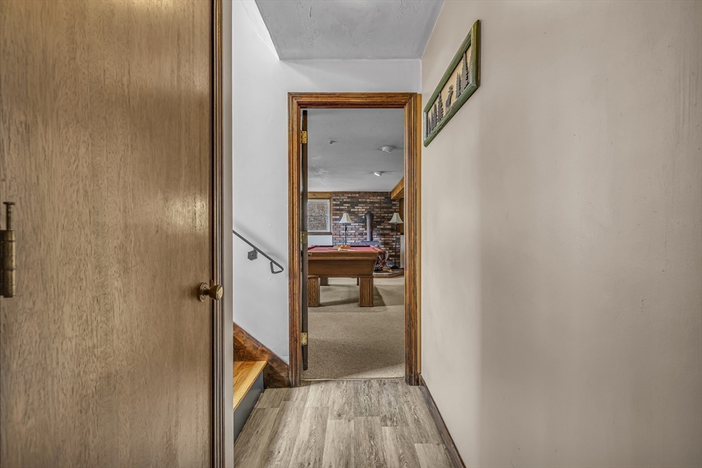 50 Harlow Road Rockland, MA 02370 - Photo 24 of 38 a view of a hallway with wooden floor and a bathroom