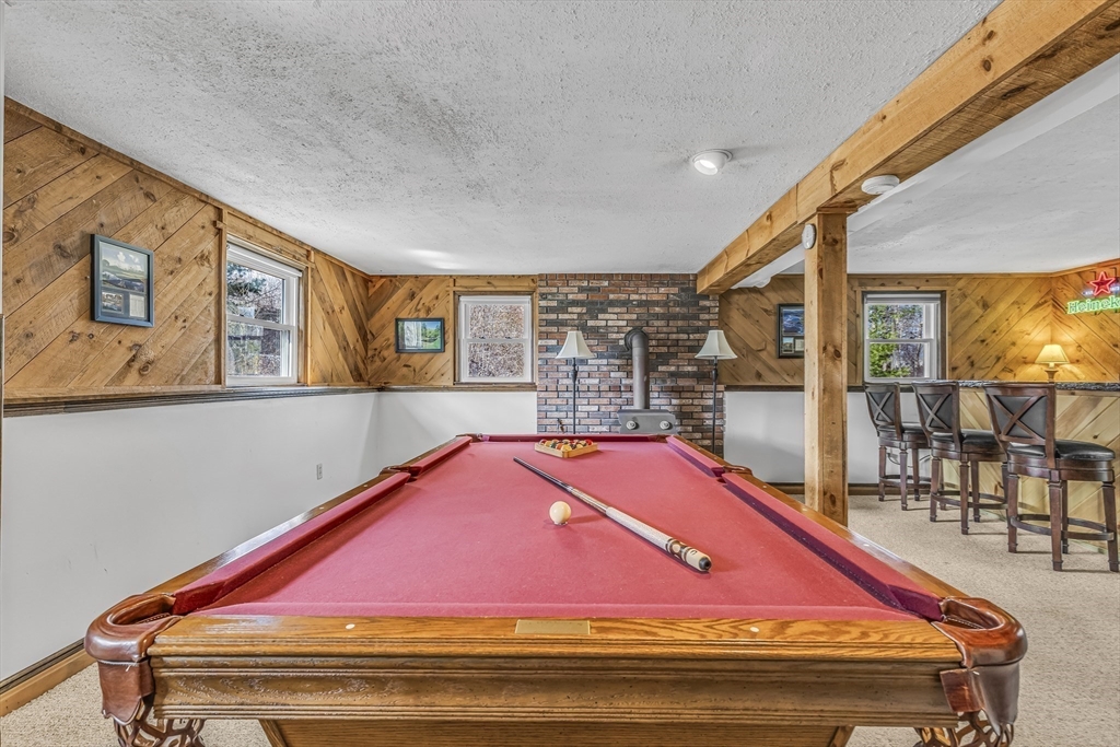 50 Harlow Road Rockland, MA 02370 - Photo 26 of 38 a sitting area with an umbrella