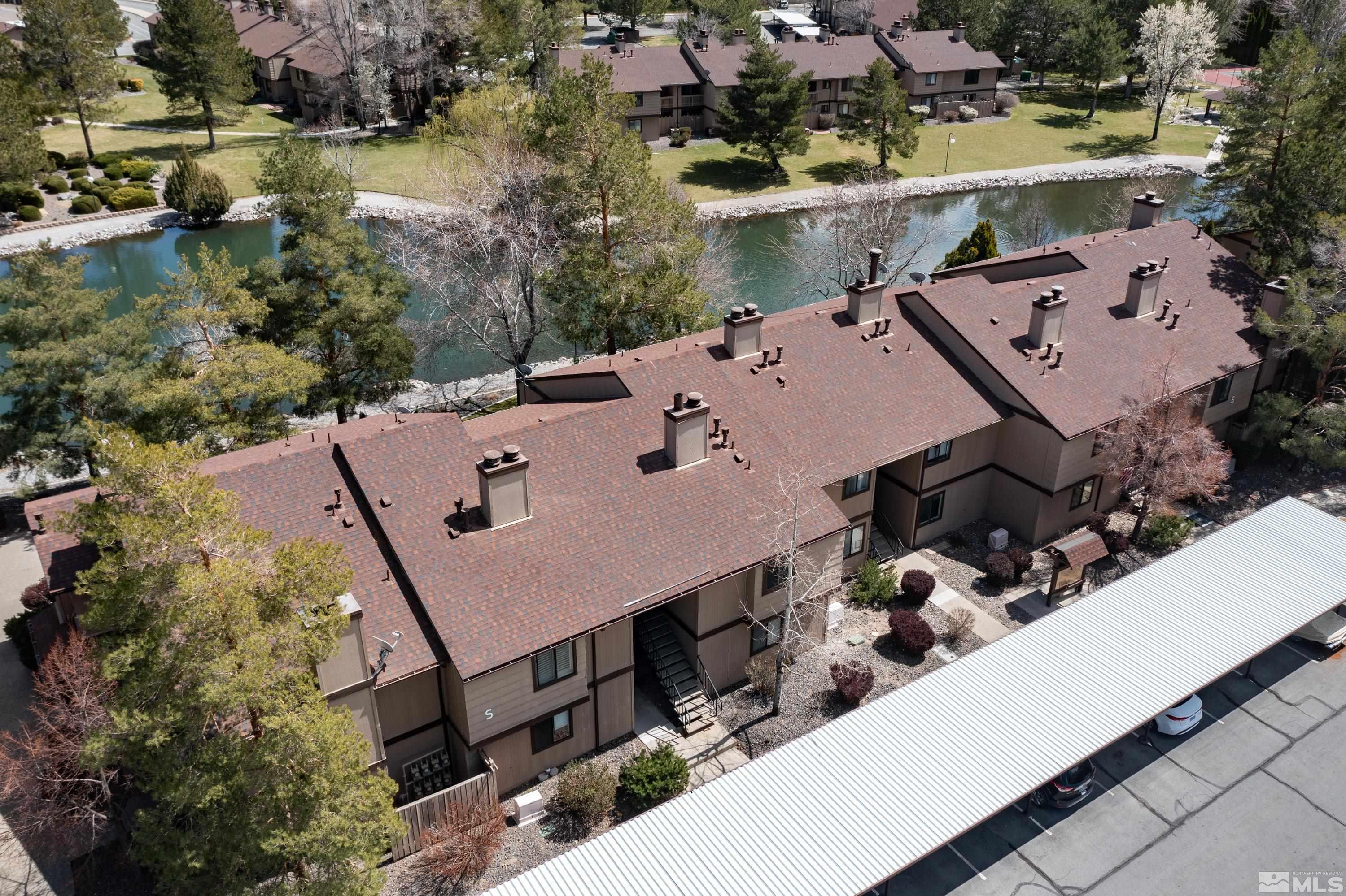 4468 Matich Drive Reno, NV 89502 - Photo 17 of 31 an aerial view of a house with a yard and lake view