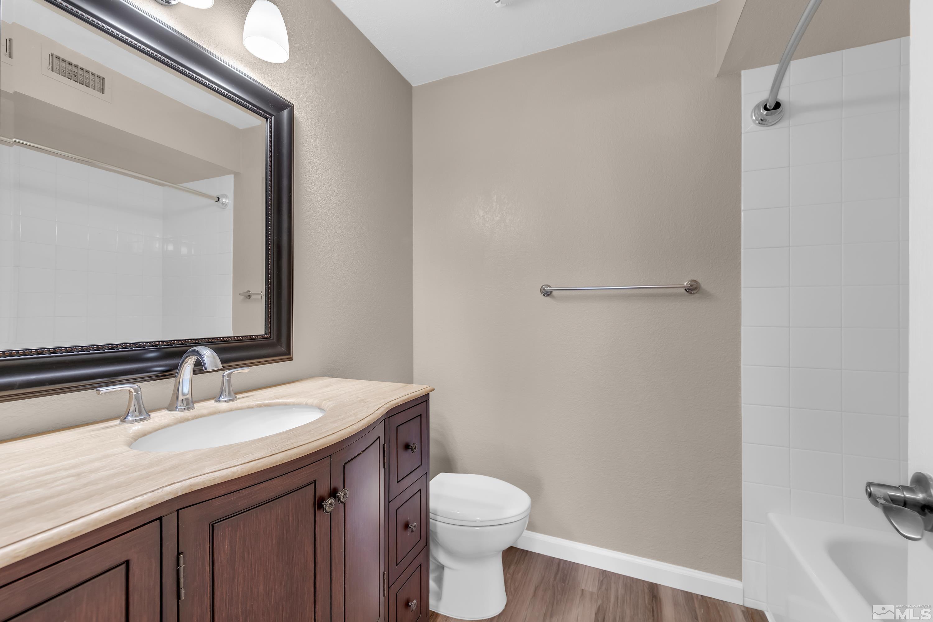 4468 Matich Drive Reno, NV 89502 - Photo 24 of 31 a bathroom with a sink toilet and vanity