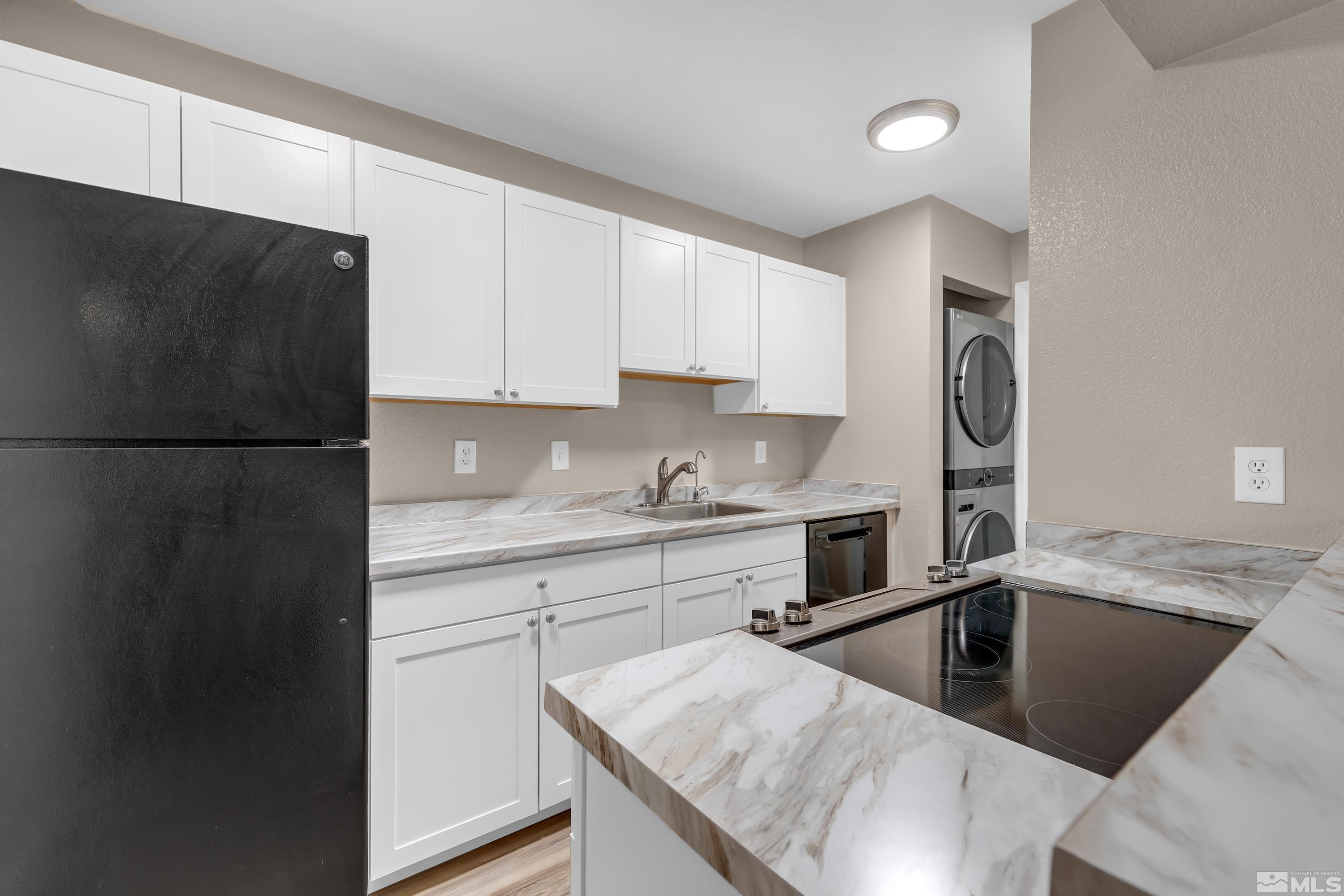 4468 Matich Drive Reno, NV 89502 - Photo 8 of 31 a kitchen with stainless steel appliances granite countertop a sink a refrigerator and a stove